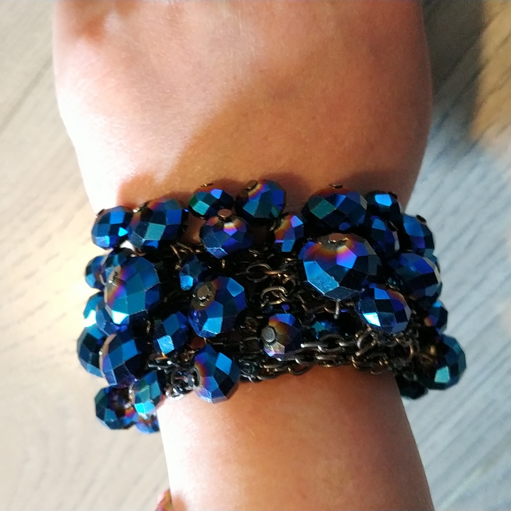 Stunning peacock iridescent blue adjustable beads bracelet.